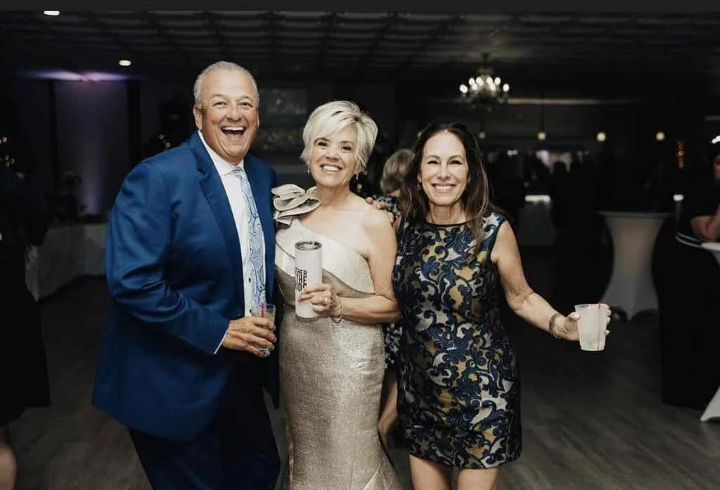 A group of people gather at Magnolia Valley Weddings & Events wedding venue. 