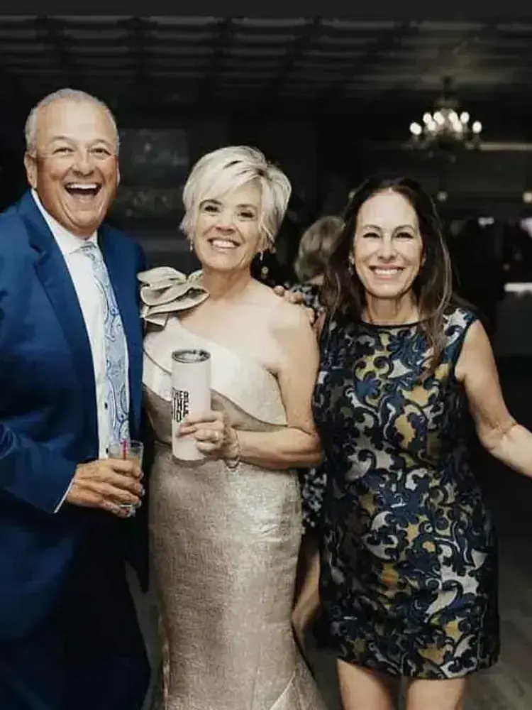 A group of people gather at Magnolia Valley Weddings & Events wedding venue. 