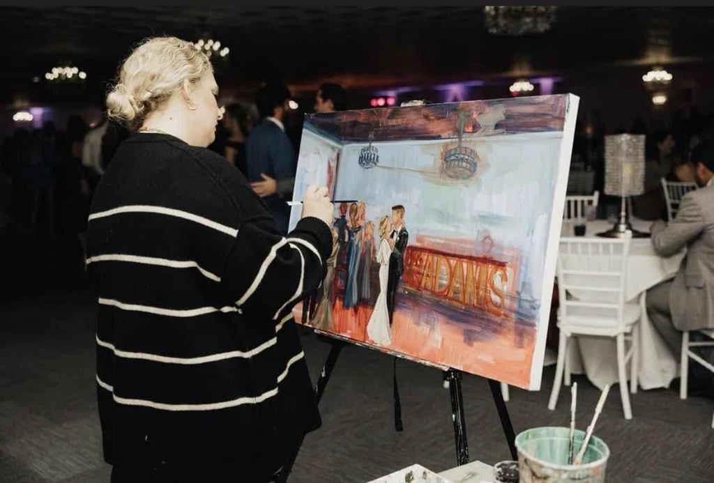 A woman paints live during an event at Magnolia Valley Weddings & Events in Harahan, Louisiana.
