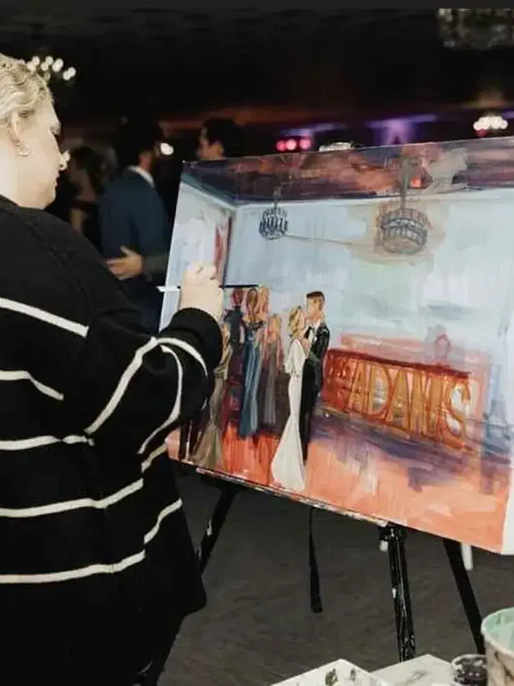 A woman paints live during an event at Magnolia Valley Weddings & Events in Harahan, Louisiana.