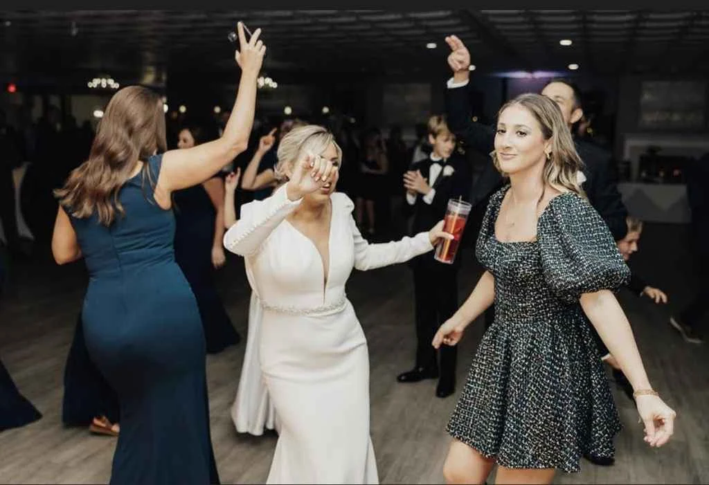 Guests dance together at Magnolia Valley Weddings & Events wedding venue.