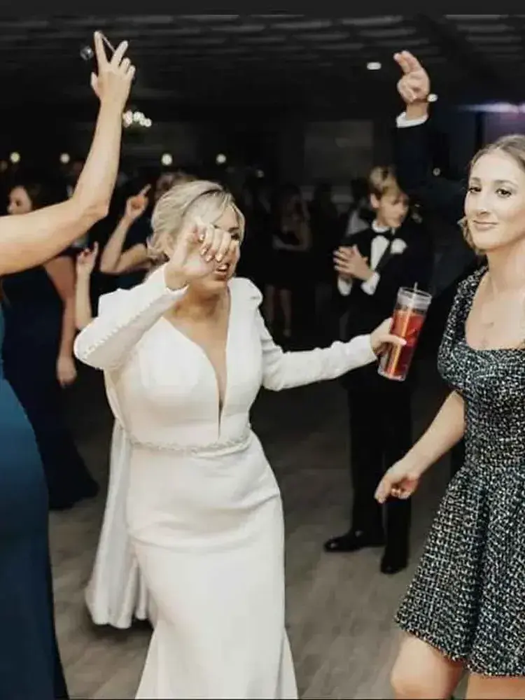 Guests dance together at Magnolia Valley Weddings & Events wedding venue.