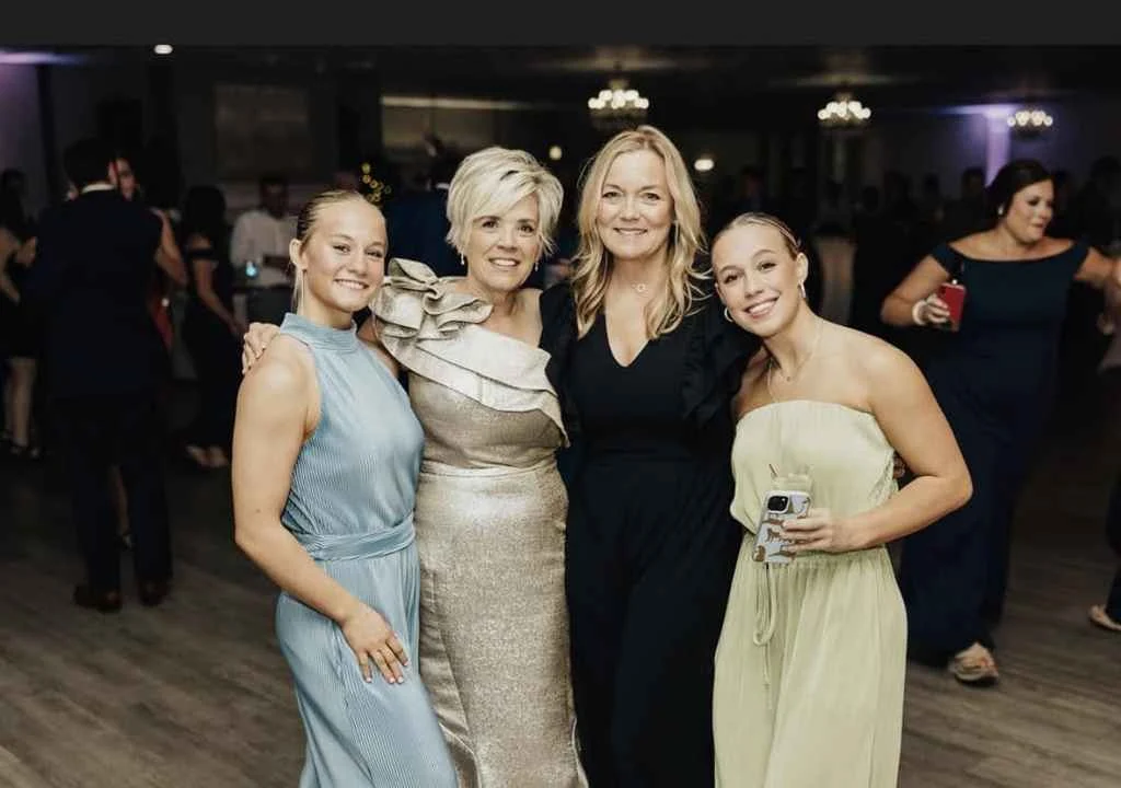 Magnolia Valley Weddings & Events group of women pose for a photograph during a wedding celebration.