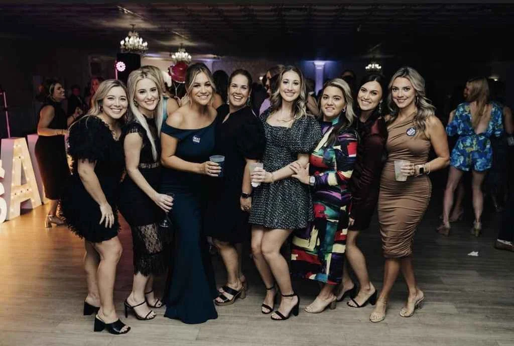 Magnolia Valley Weddings & Events group of women pose for the camera at a wedding reception.