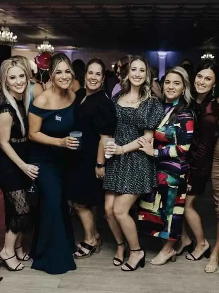 Magnolia Valley Weddings & Events group of women pose for the camera at a wedding reception.